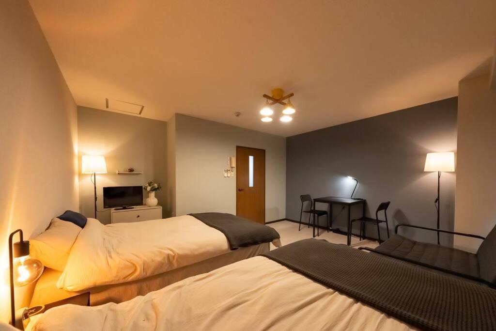 難波駅、道頓堀のそばでシンプルステイ　ベッド3台のお部屋 Apartment Osaka